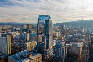 A skyscraper rises above the Portland skyline